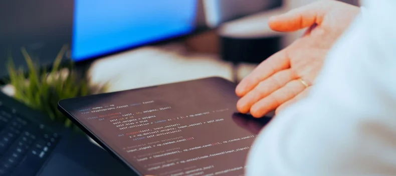 Modern mobile app development interface showing UI/UX design screens and coding environment representing app development companies in Lebanon by Sync